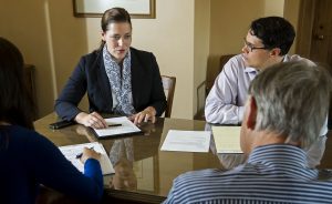 LINCOLN, NEB - 07/25/2014 - Inspector general of Nebraska child welfare Julie Rogers (second from left) speaks with Ombudsman's Office colleagues Julie Pham (from left), Sean Schmeits and Marshall Lux during a meeting on Friday, July 25, 2014, in the Ombudsman's Office conference room at the Capitol Building. KRISTIN STREFF/Lincoln Journal Star